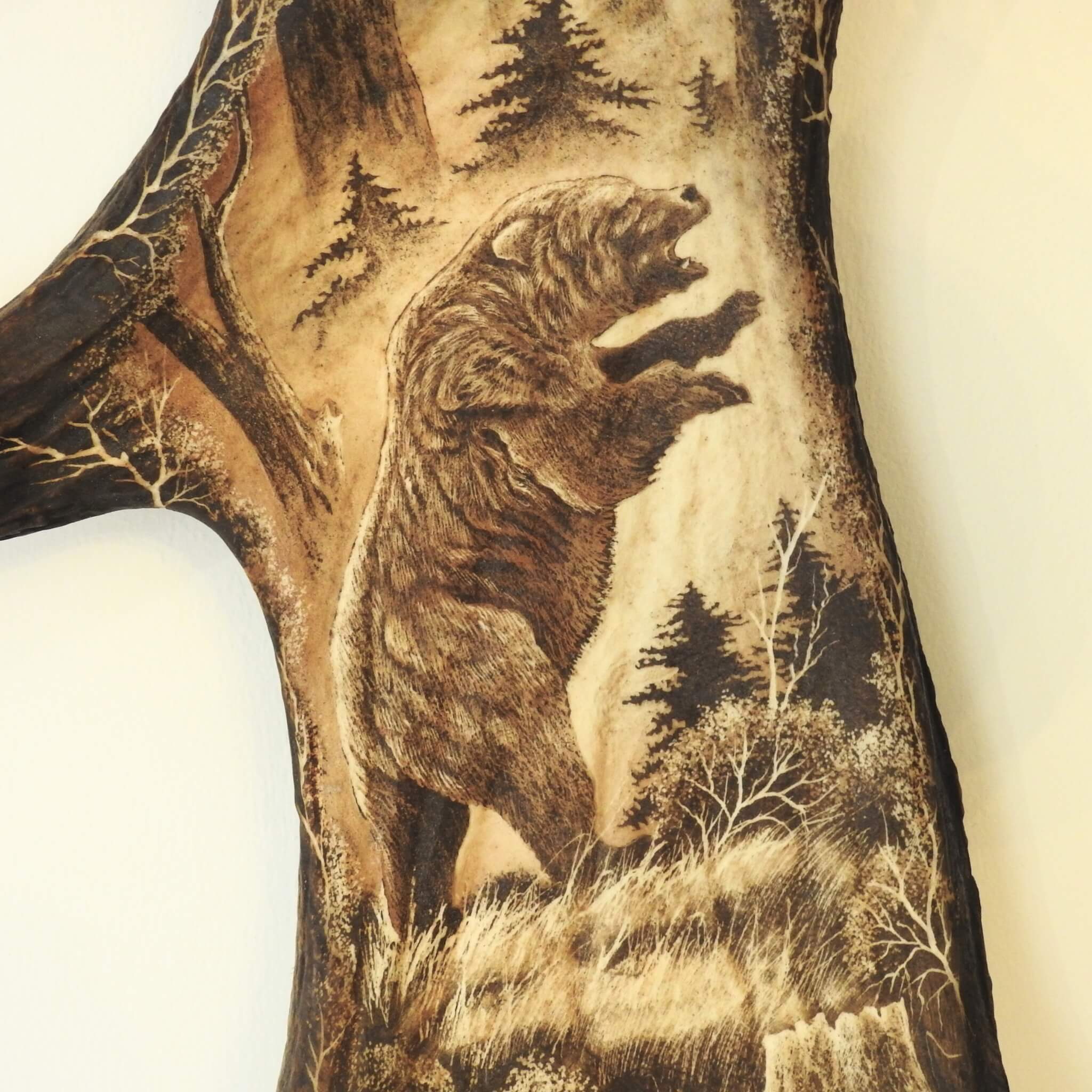 Bear carving on moose shed.