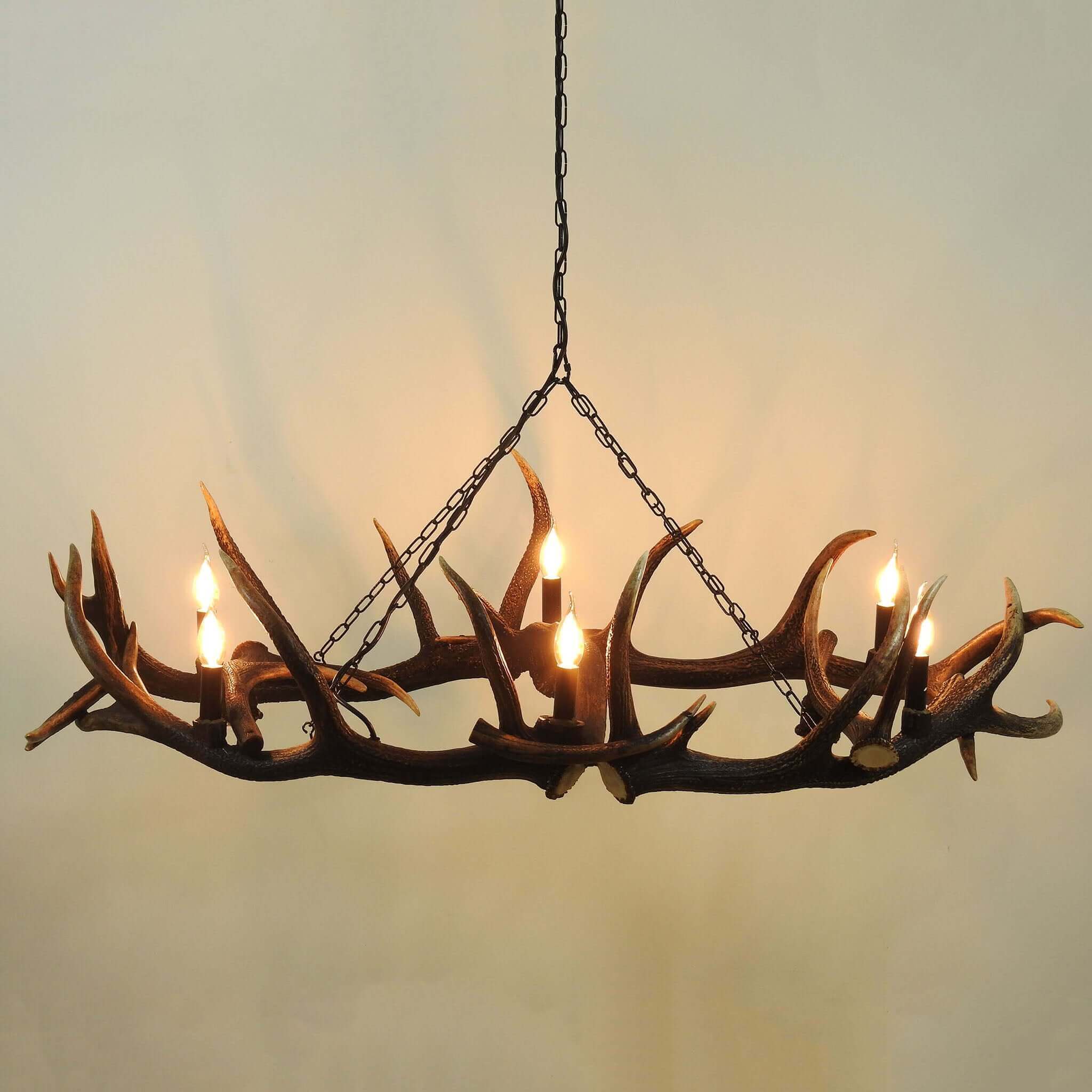 Large antler chandelier hanging on chain.
