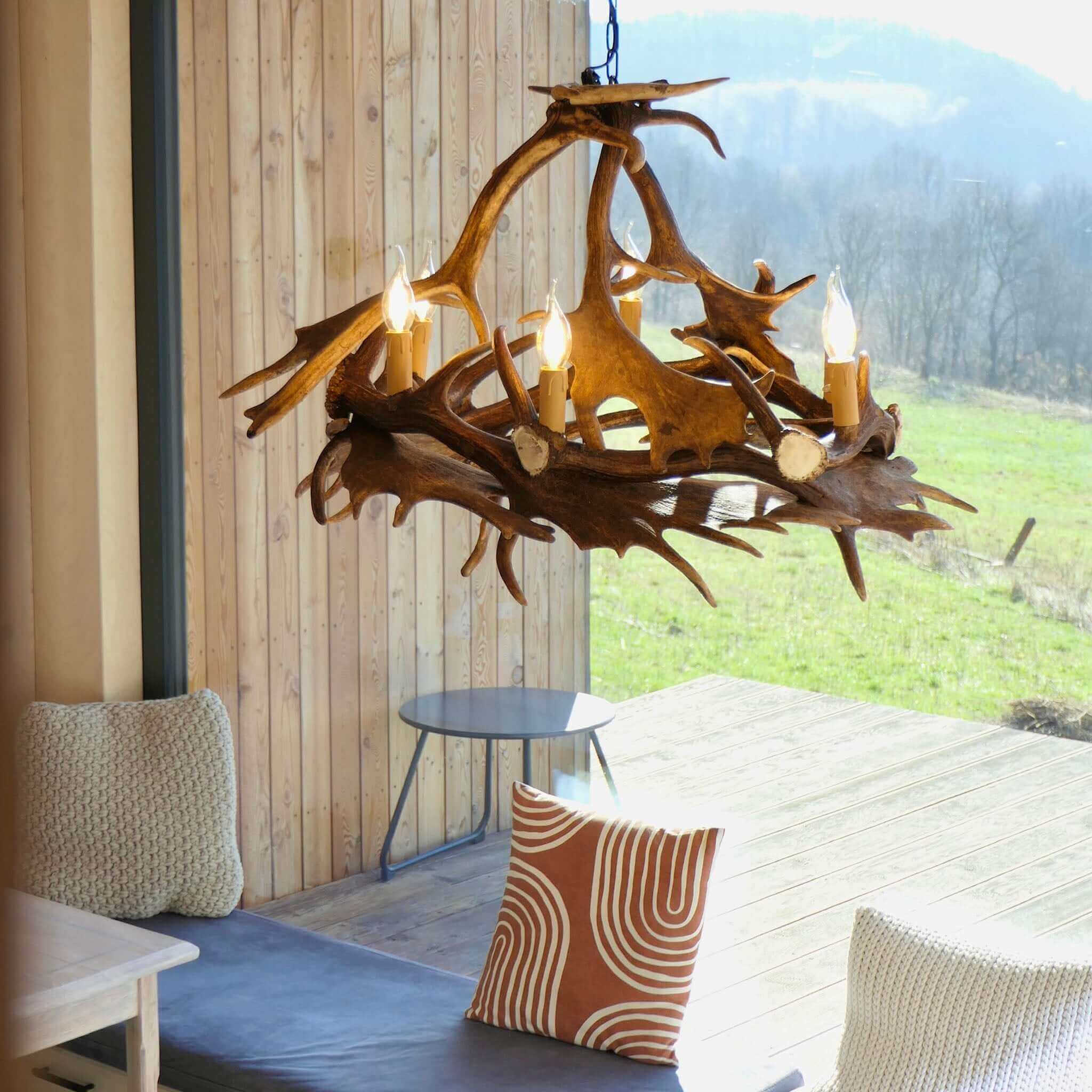 Farmhouse antler chandelier in modern interior.