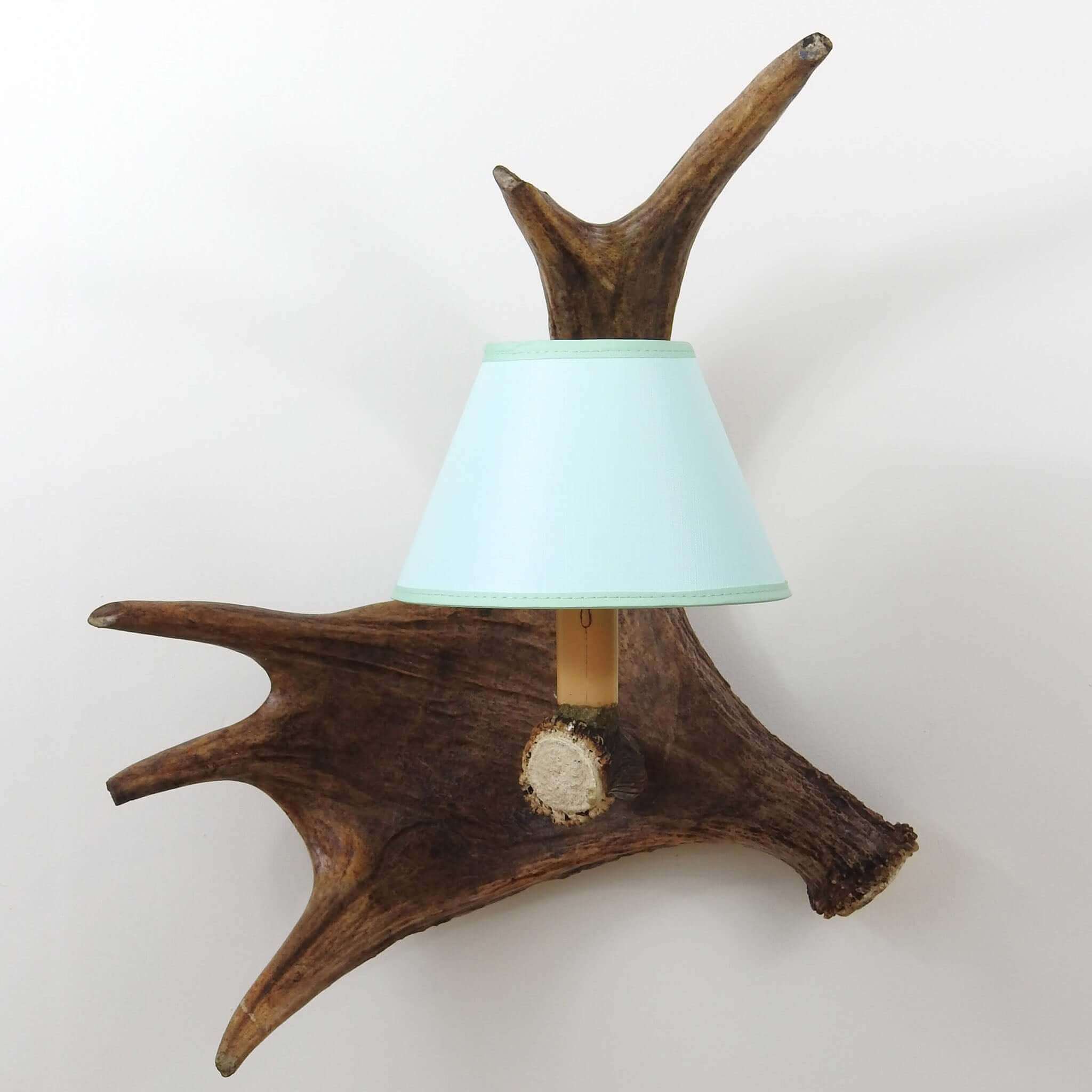 Rustic antler wall chandelier.