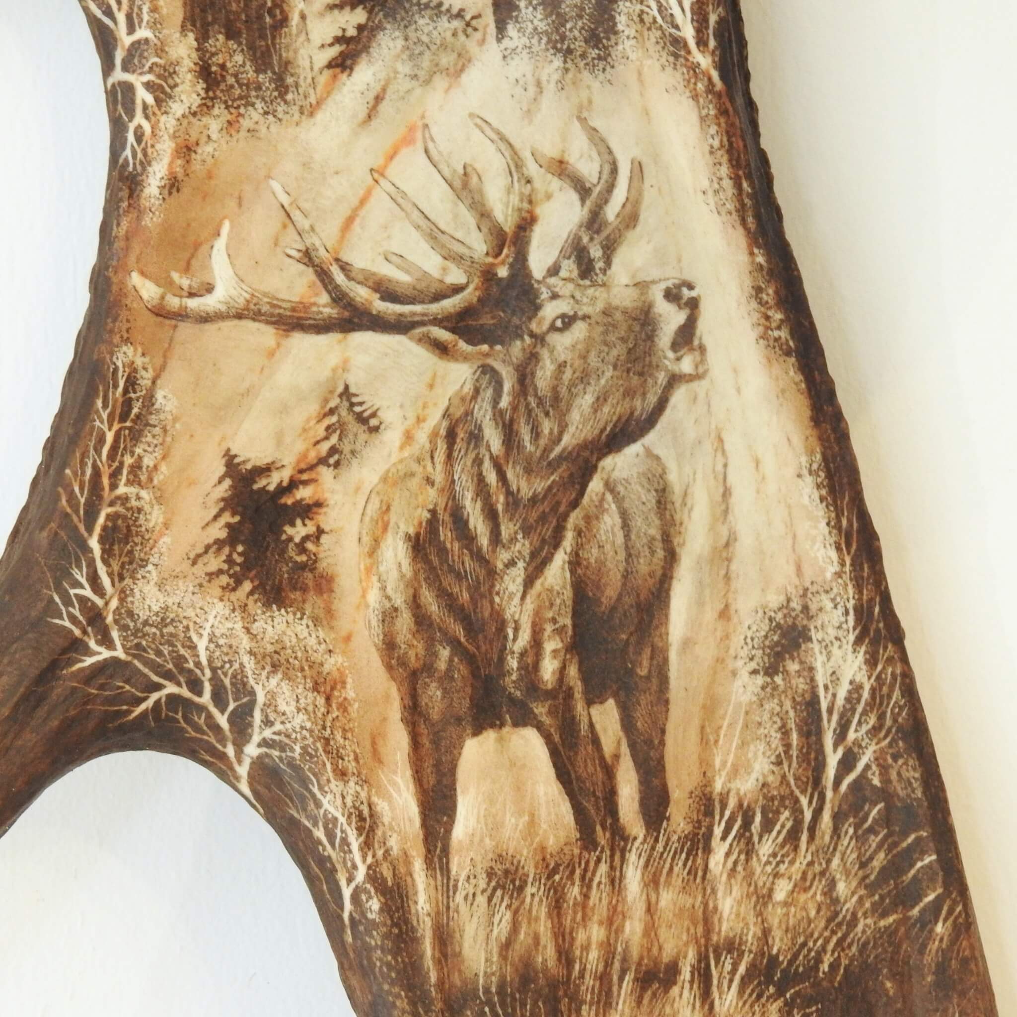 Carved roaring red deer.