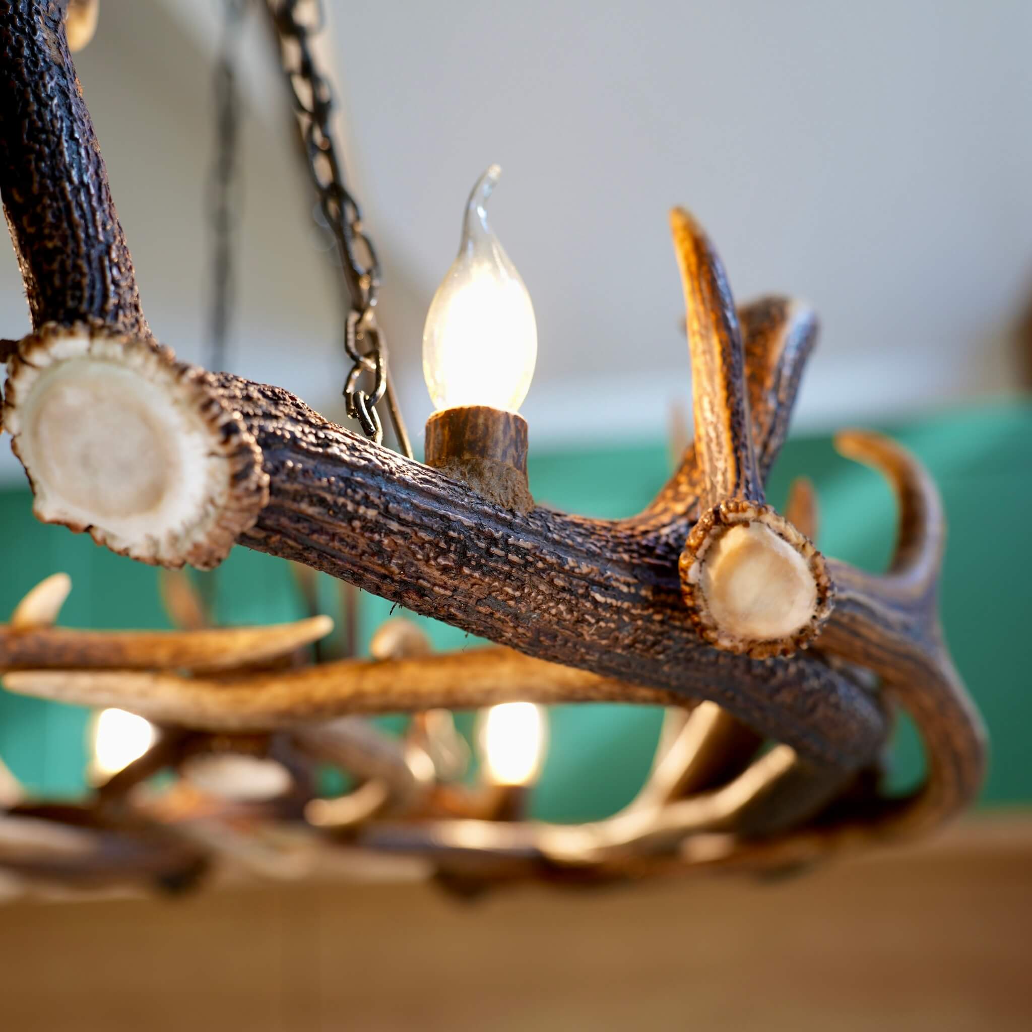 Bulb in rustic style antler chandelier for 4 lights.