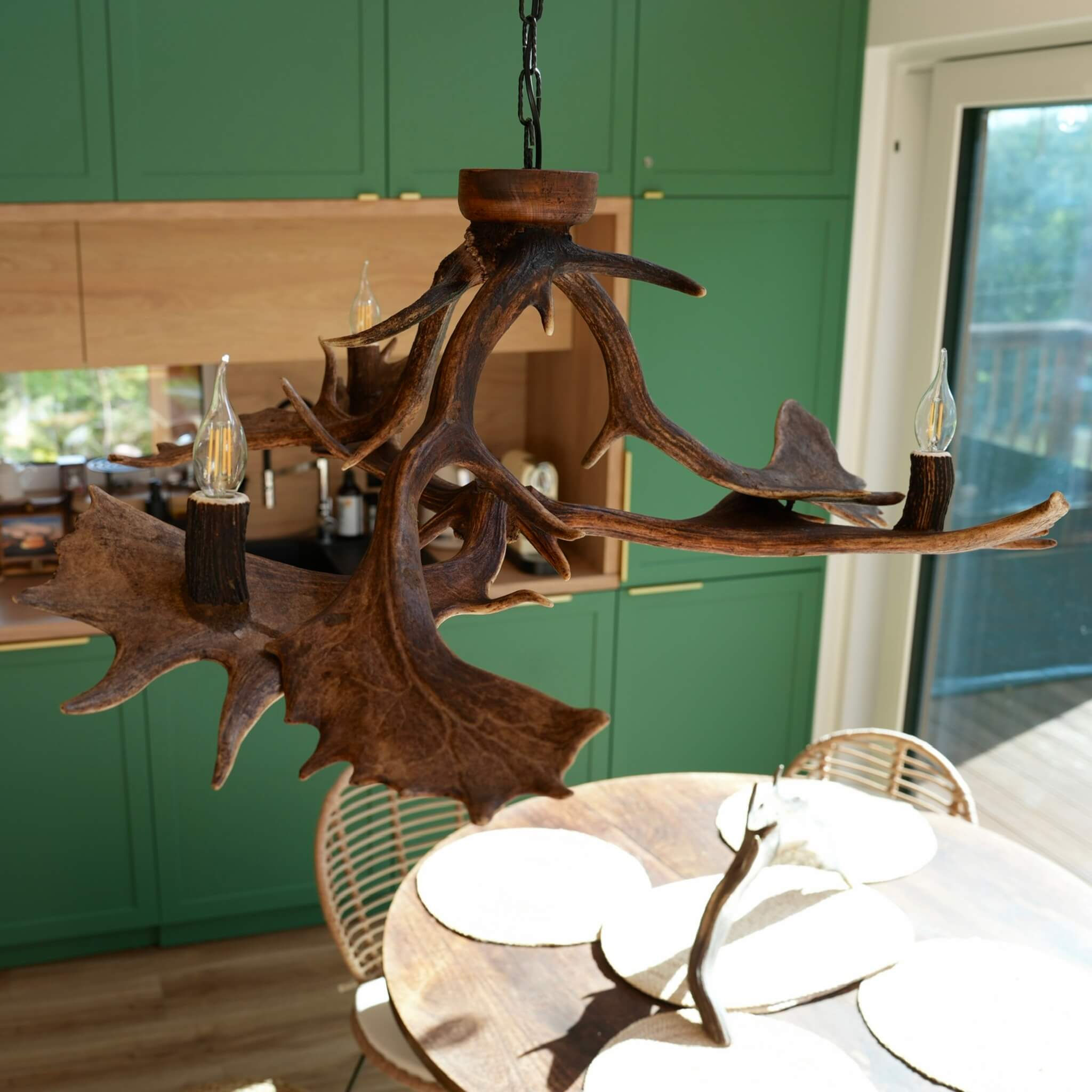 Elegant antler chandelier with three lights, blending rustic charm and modern style.