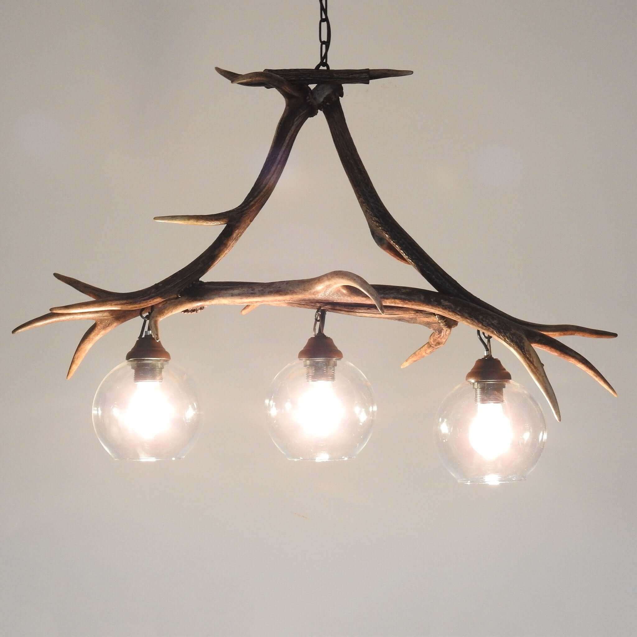Real antler pendant lamp featuring elegant red deer antlers - a rustic touch for your home decor.