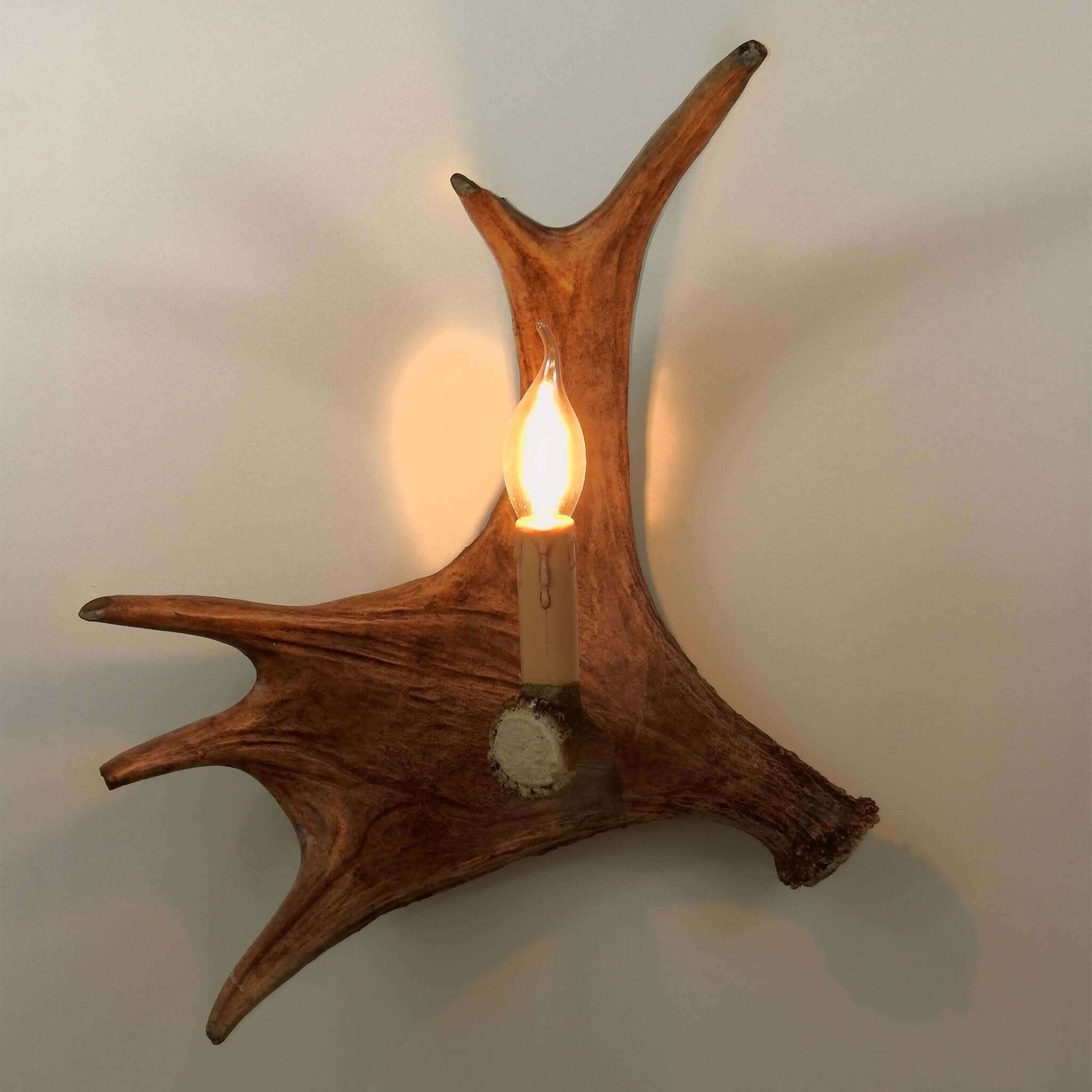 Rustic antler sconce made of moose antlers.