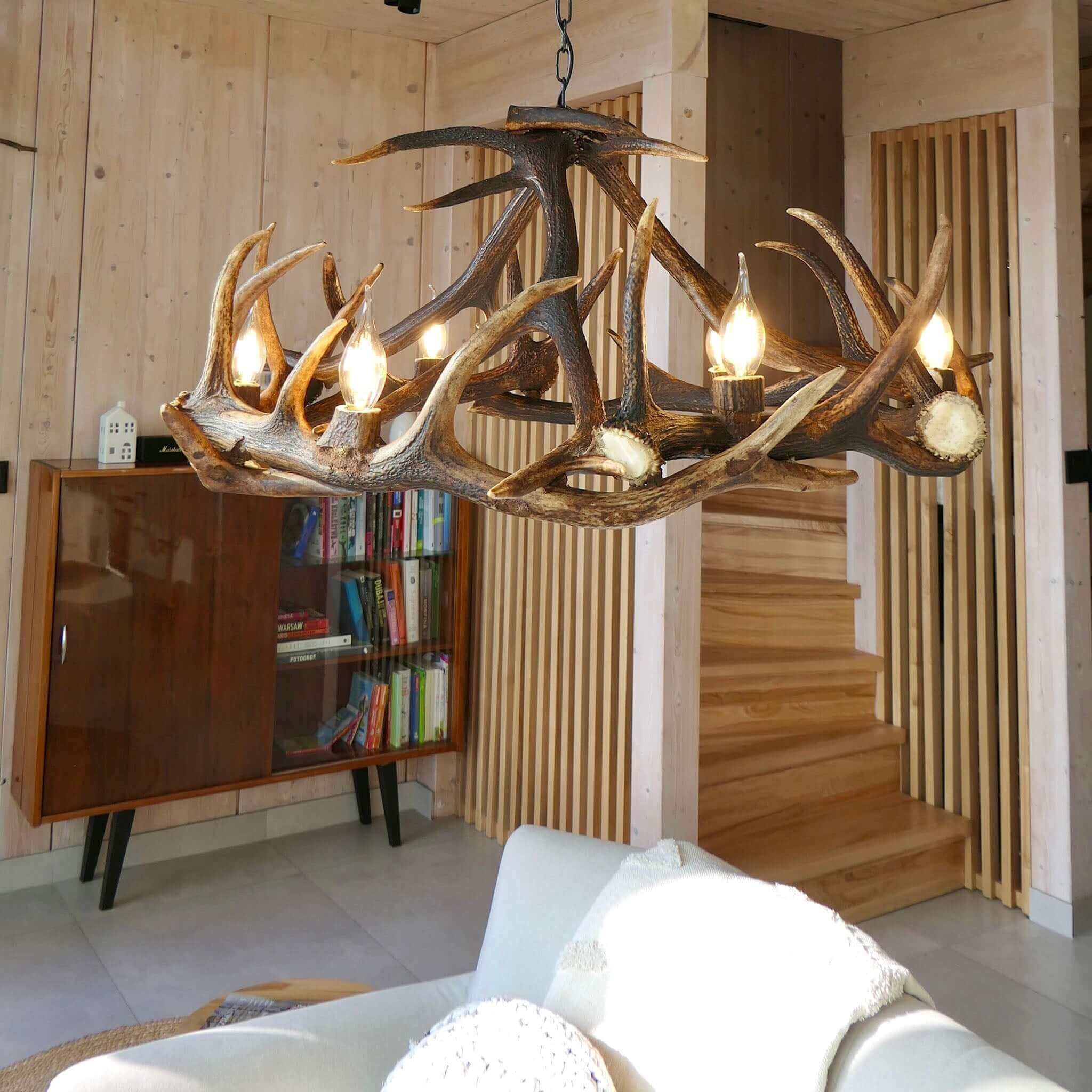 Deer antler chandelier in living room.