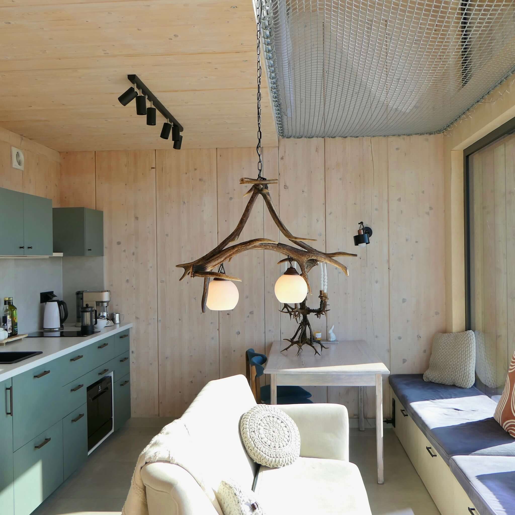 Real antler pendant lamp in living room.