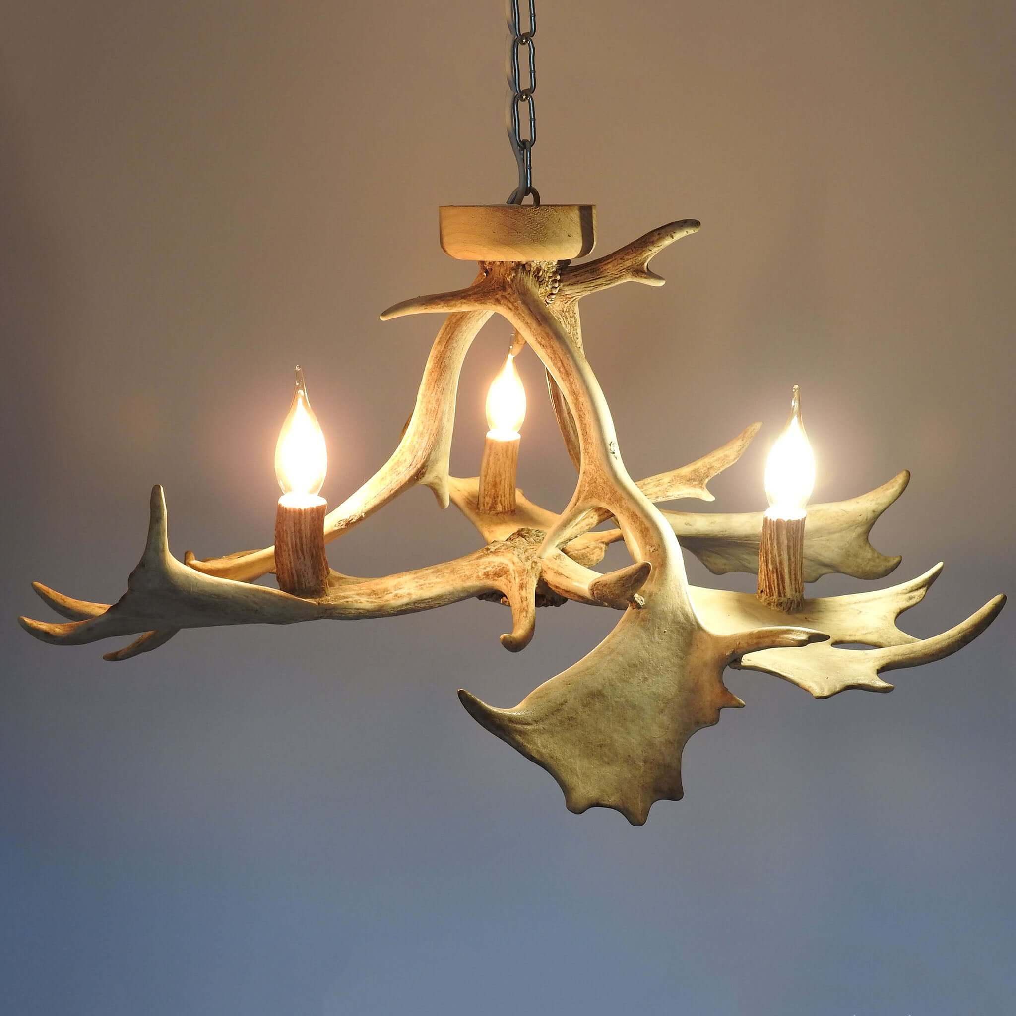 White antler chandelier in rustic style.