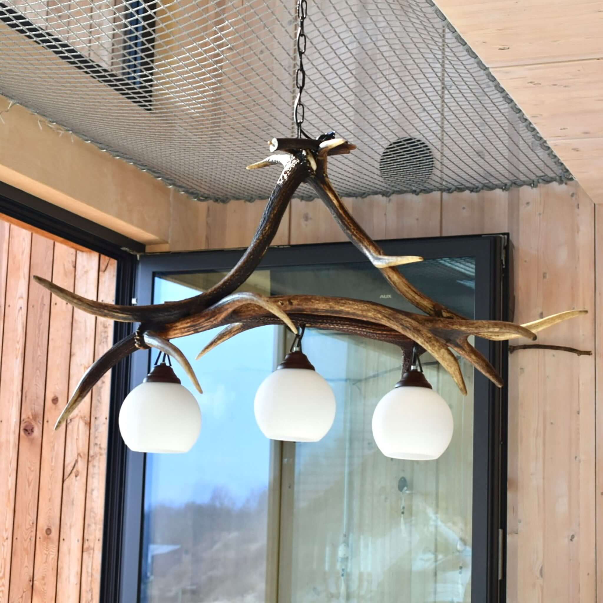 Real antler light fixture for 3 lights with shades. This antler lighting was made of red deer antlers.