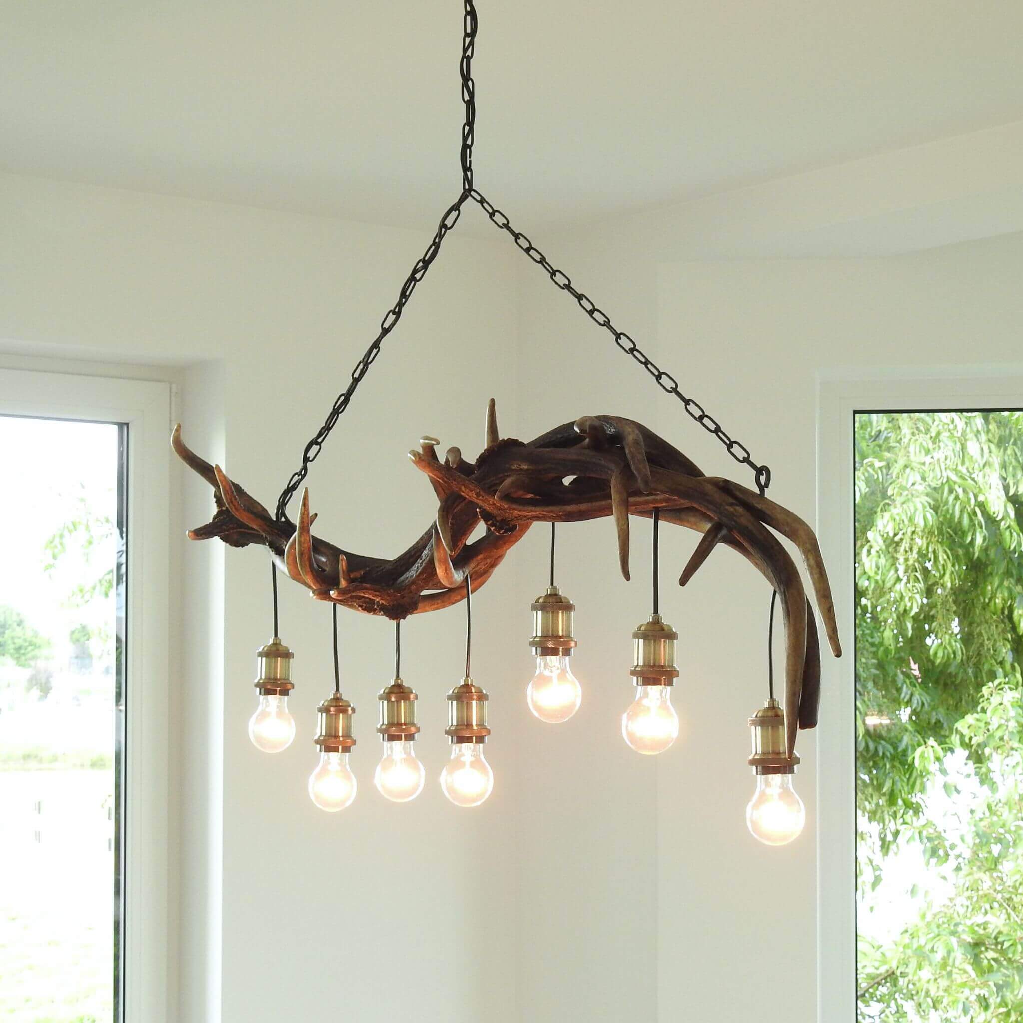 Antler pendant lamp for log rustic cabin.