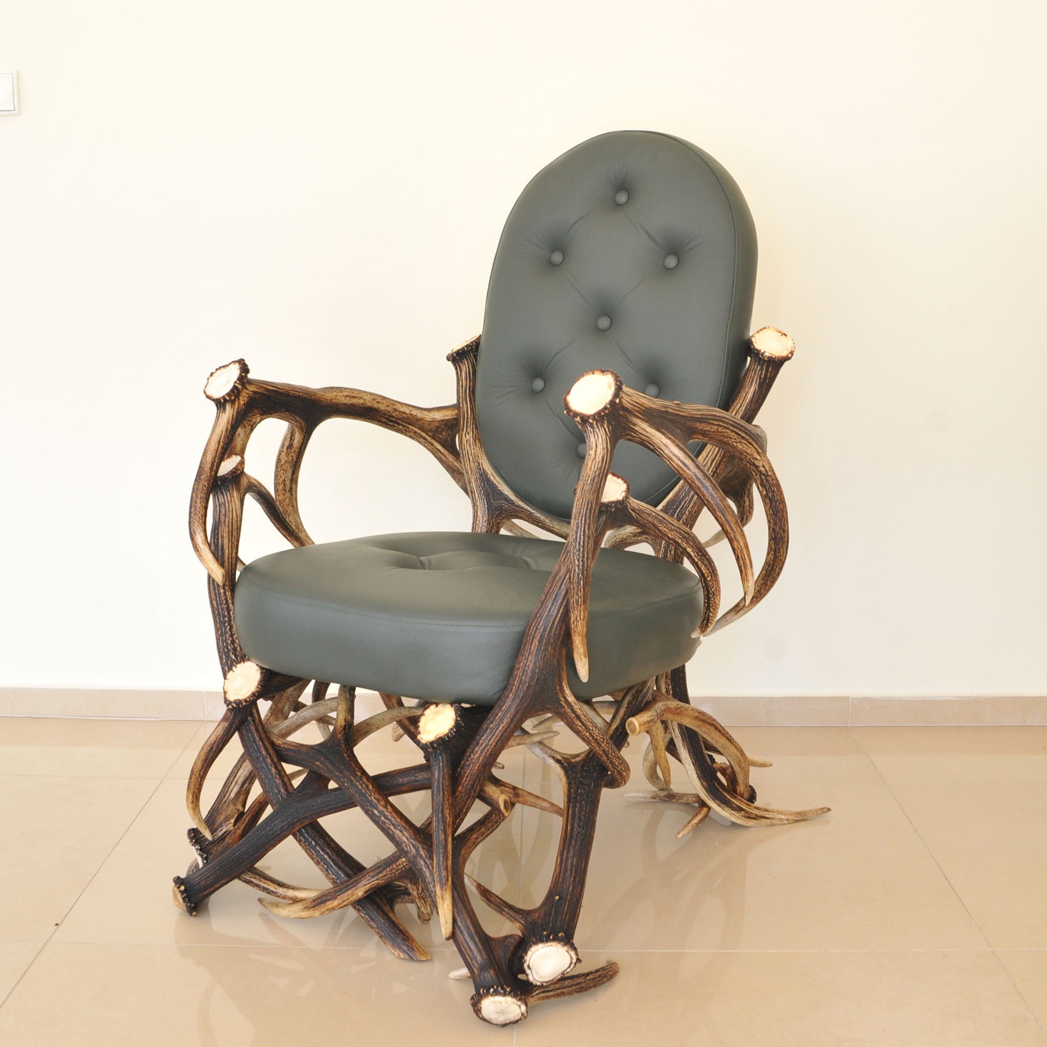 Real antler chair ith leather upholstery.