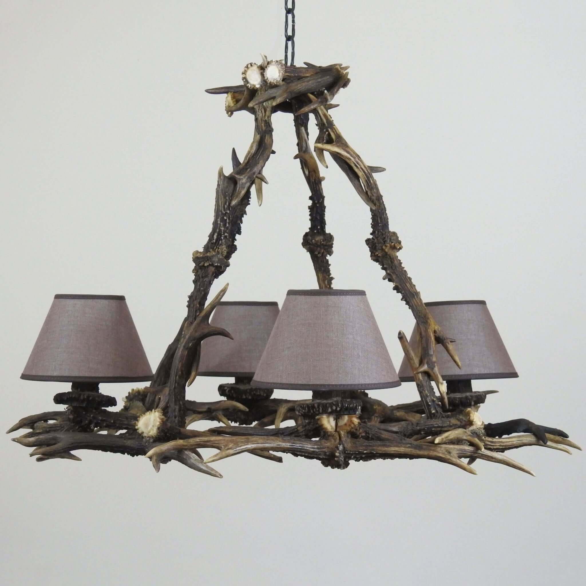 Farmhouse antler chandelier with brown shades.