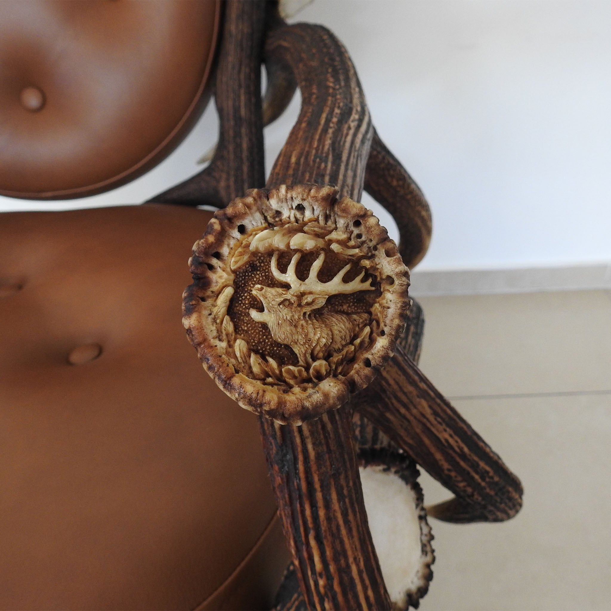 Antler chair with sculpture in burr.