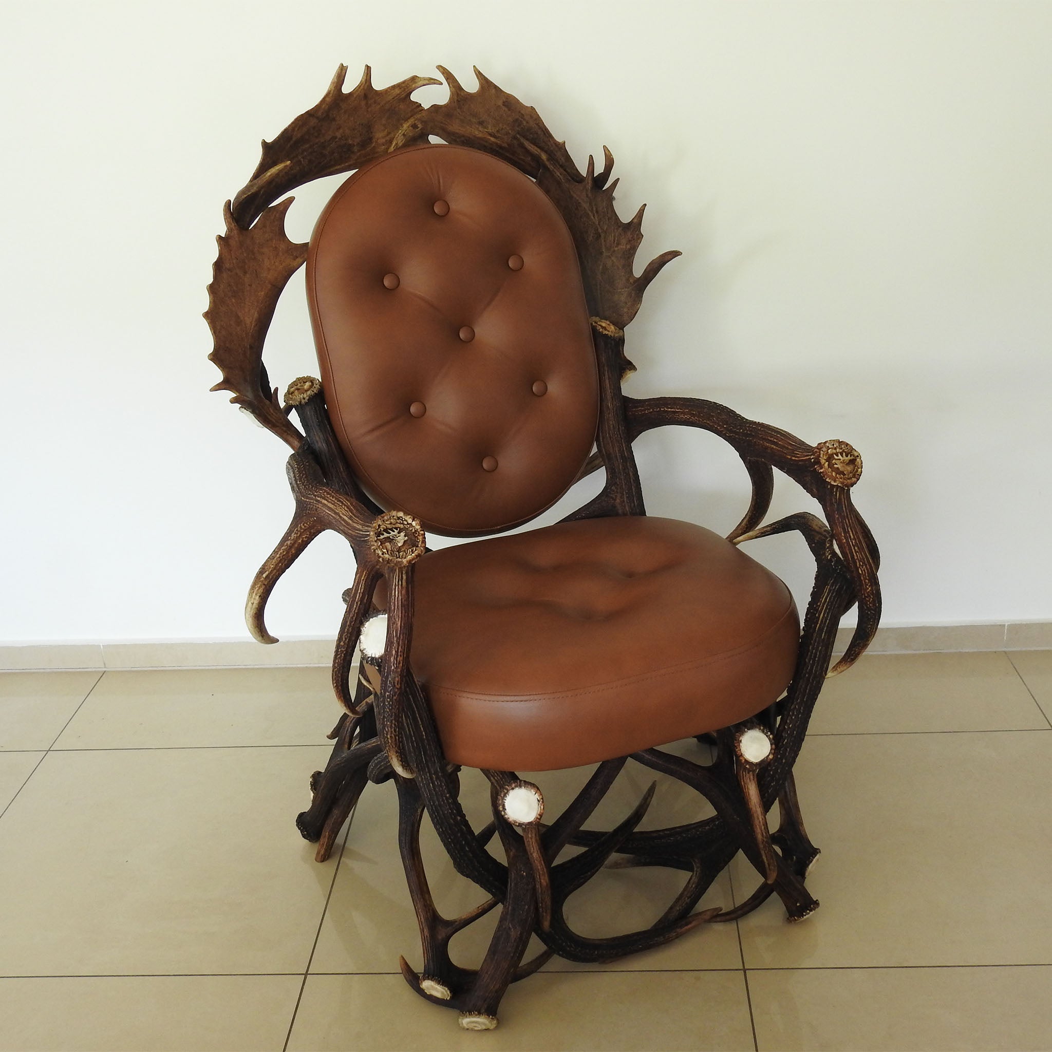 Real antler armchair with carvings.