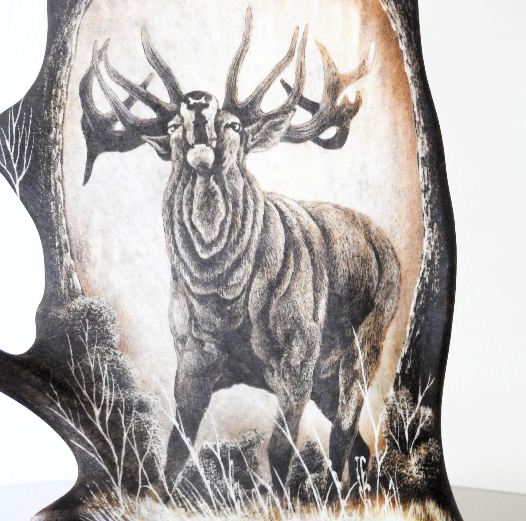 Antler painting shows roaring red deer.