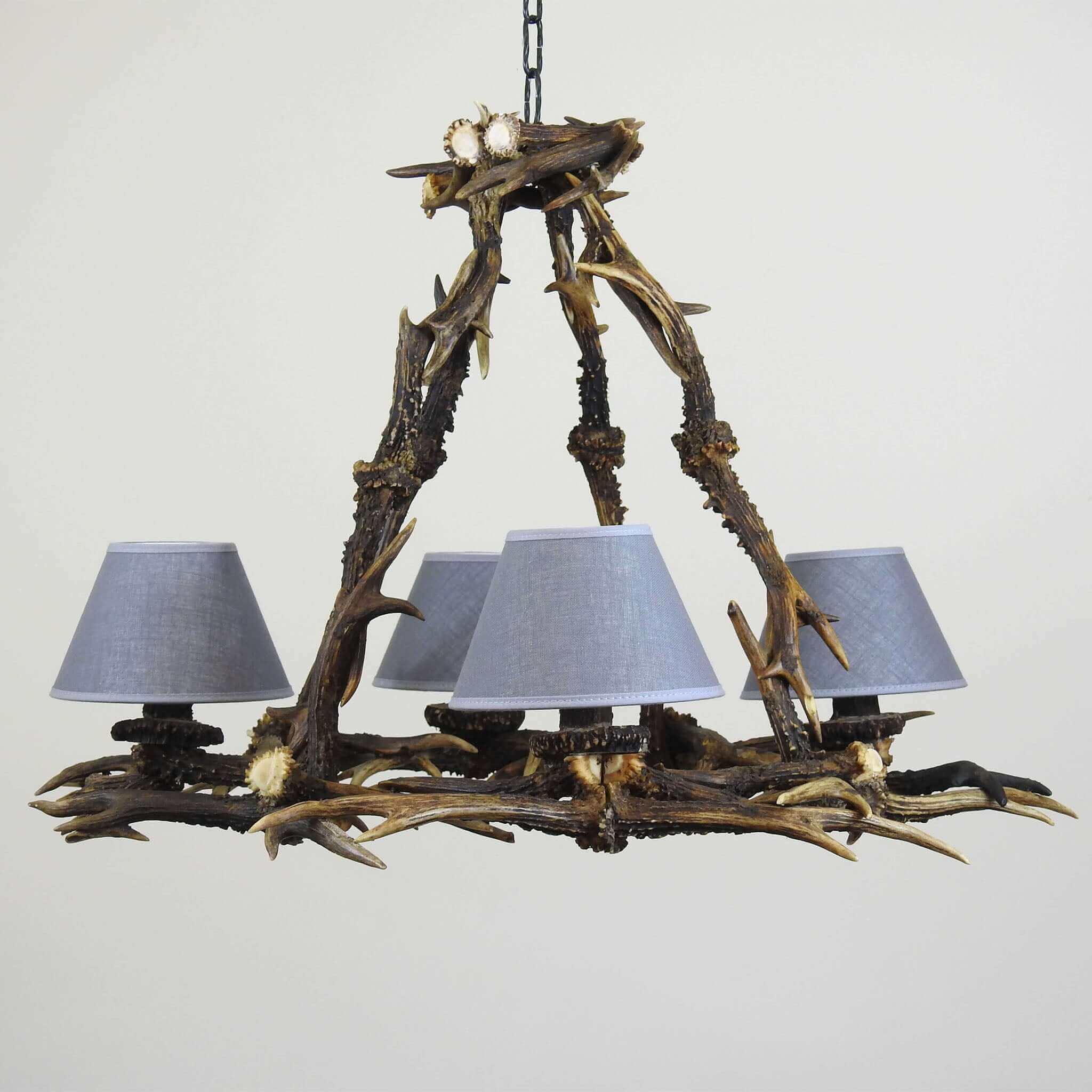 Real antler chandelier for 4 lights with grey shades.
