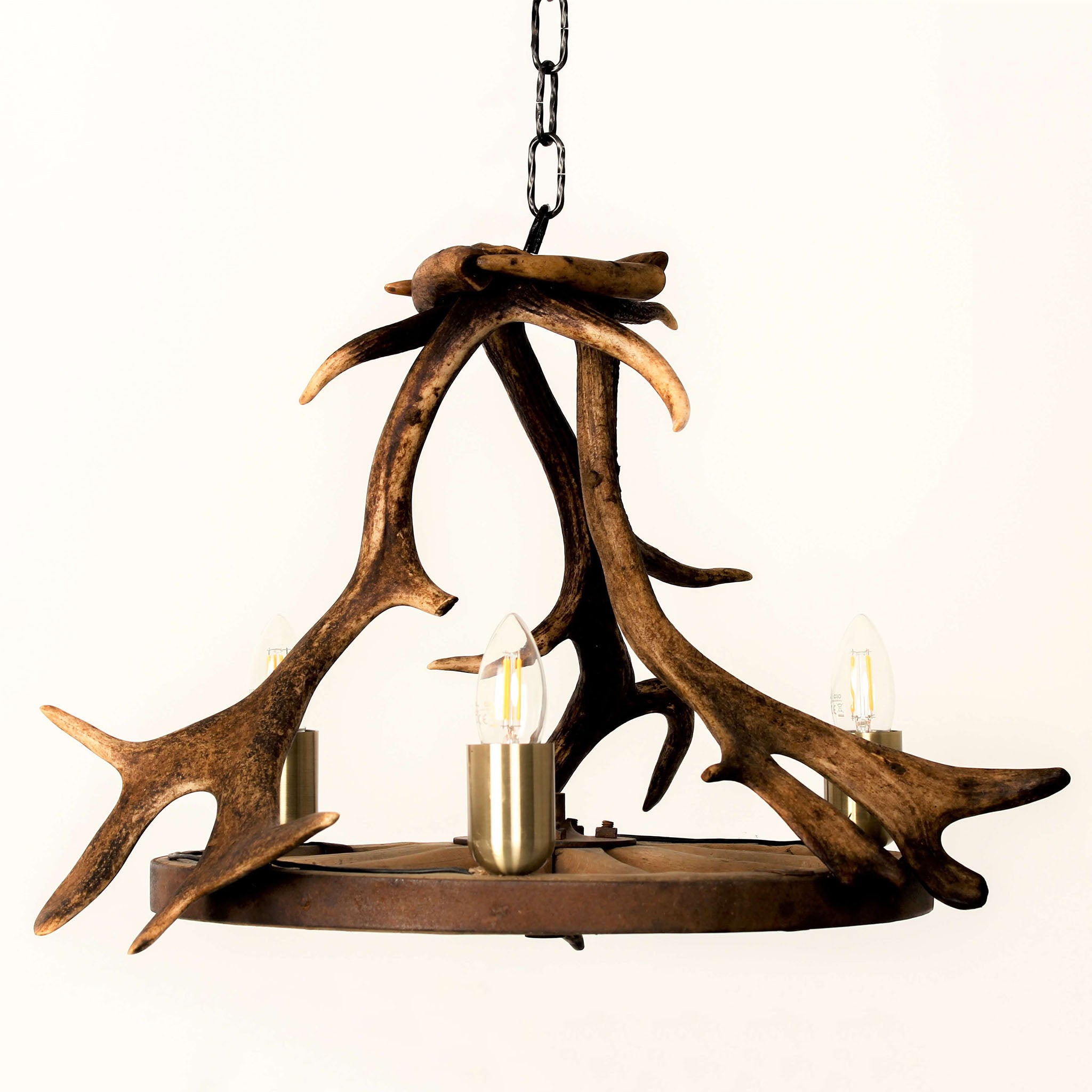 Fallow deer antler chandelier with wagon wheel.