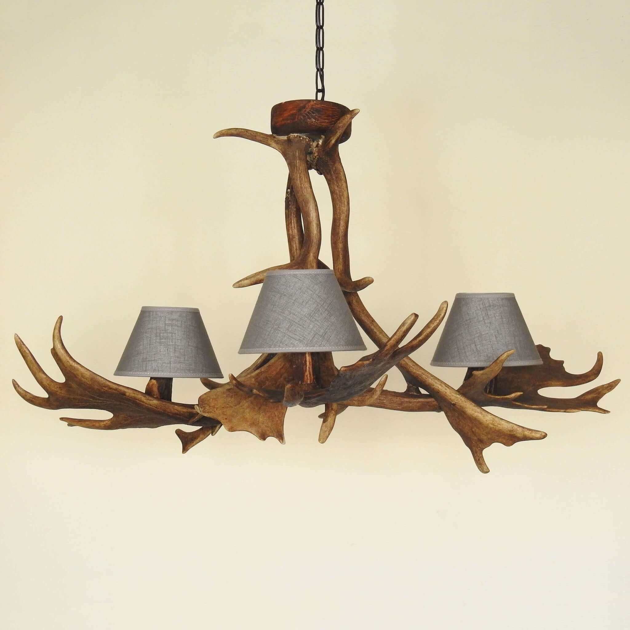 Rustic style antler chandelier with shades.