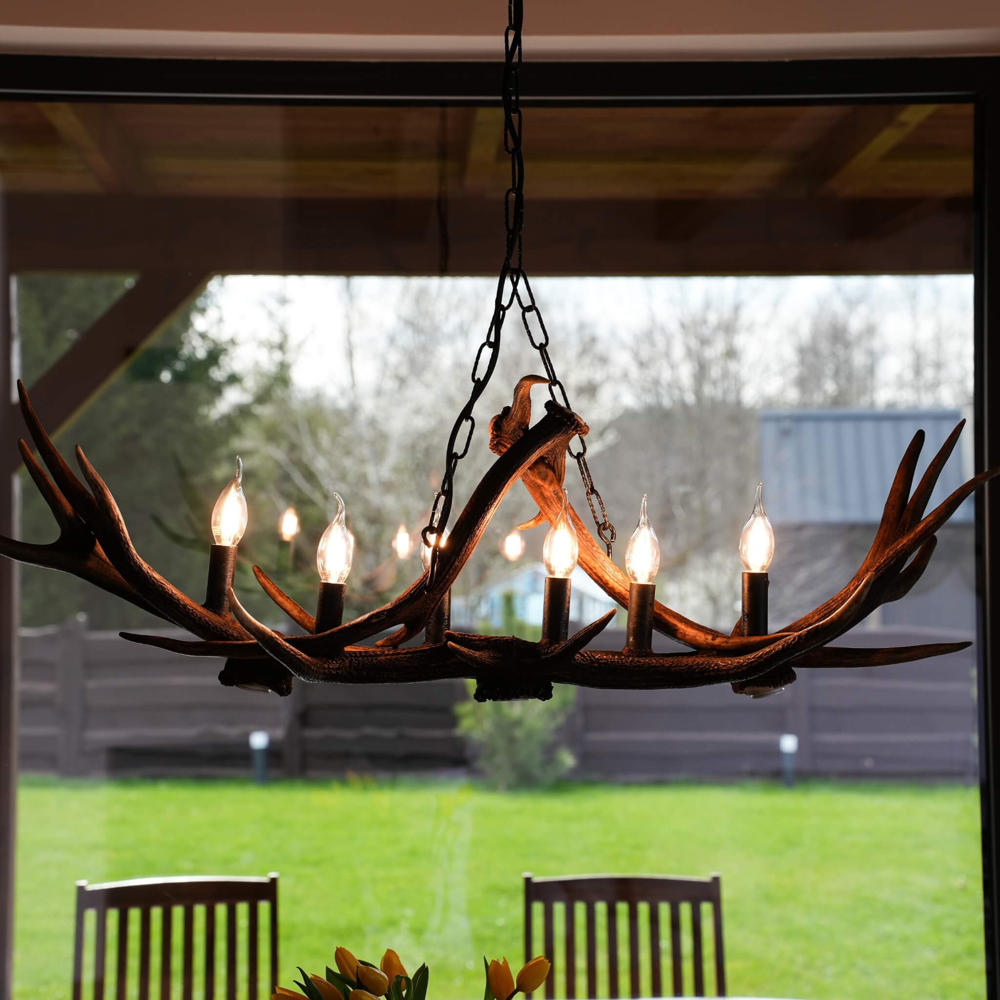 Antler candelier in log cabin.