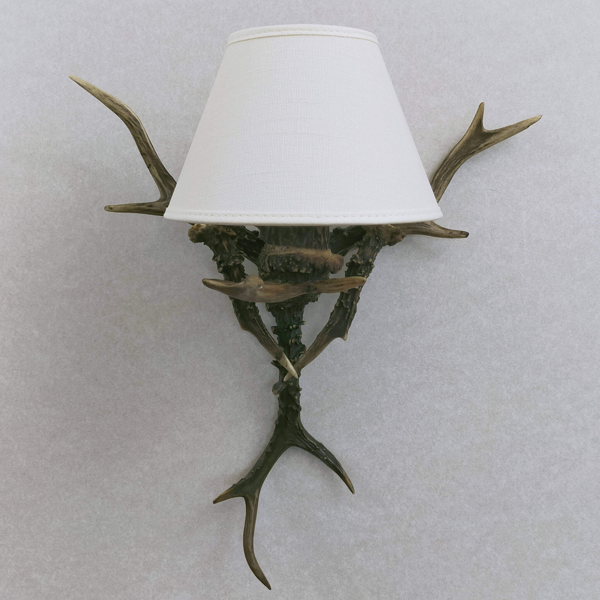 Real small antler sconce with shade.