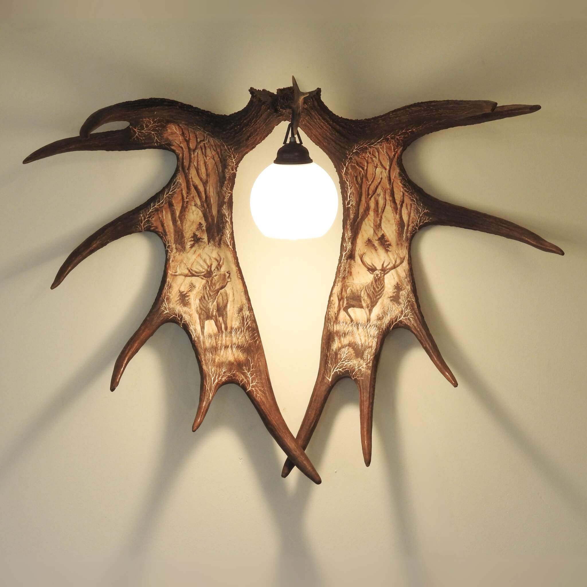 Real moose antler carving with sconce.