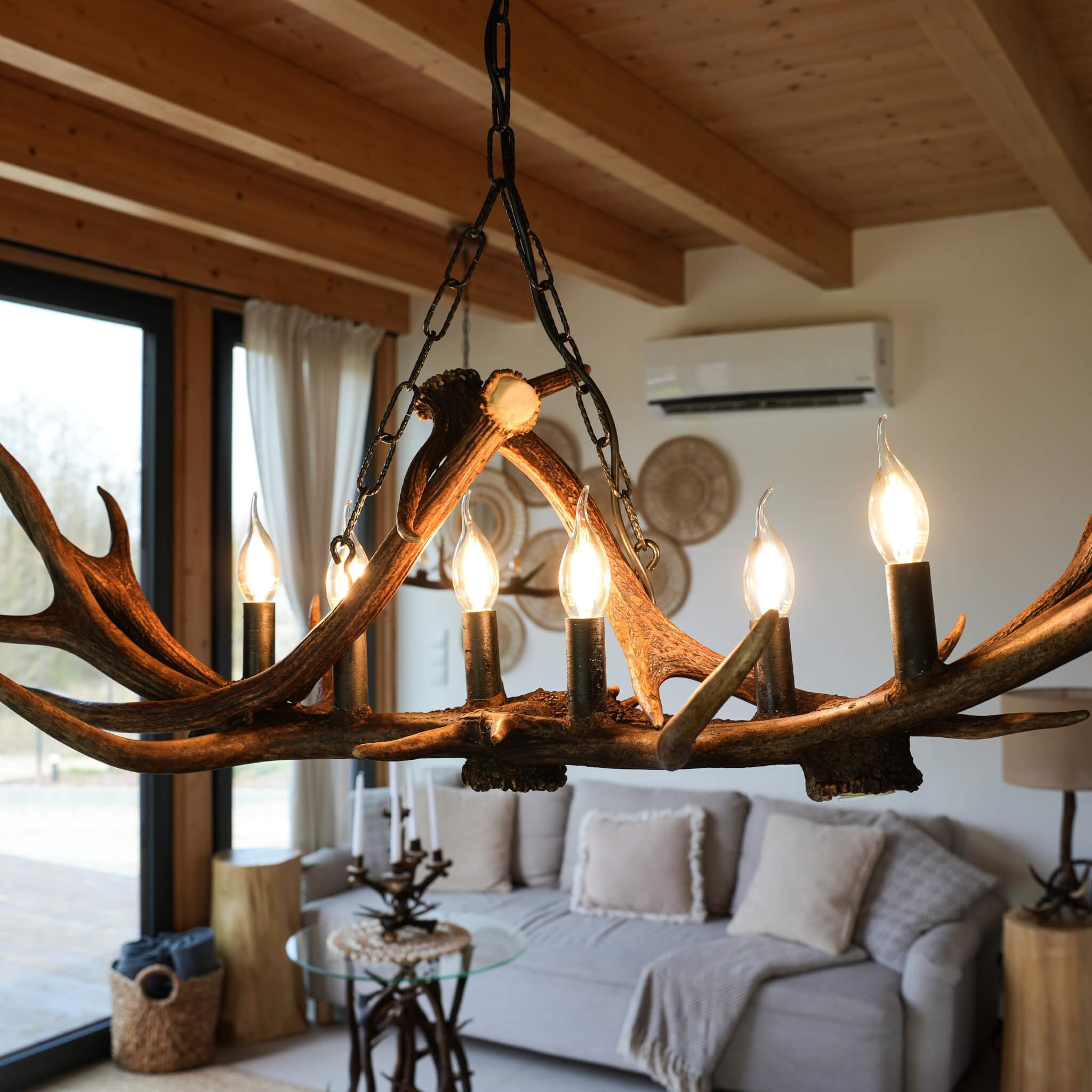 Antler chandelier in modern farmhouse living room.