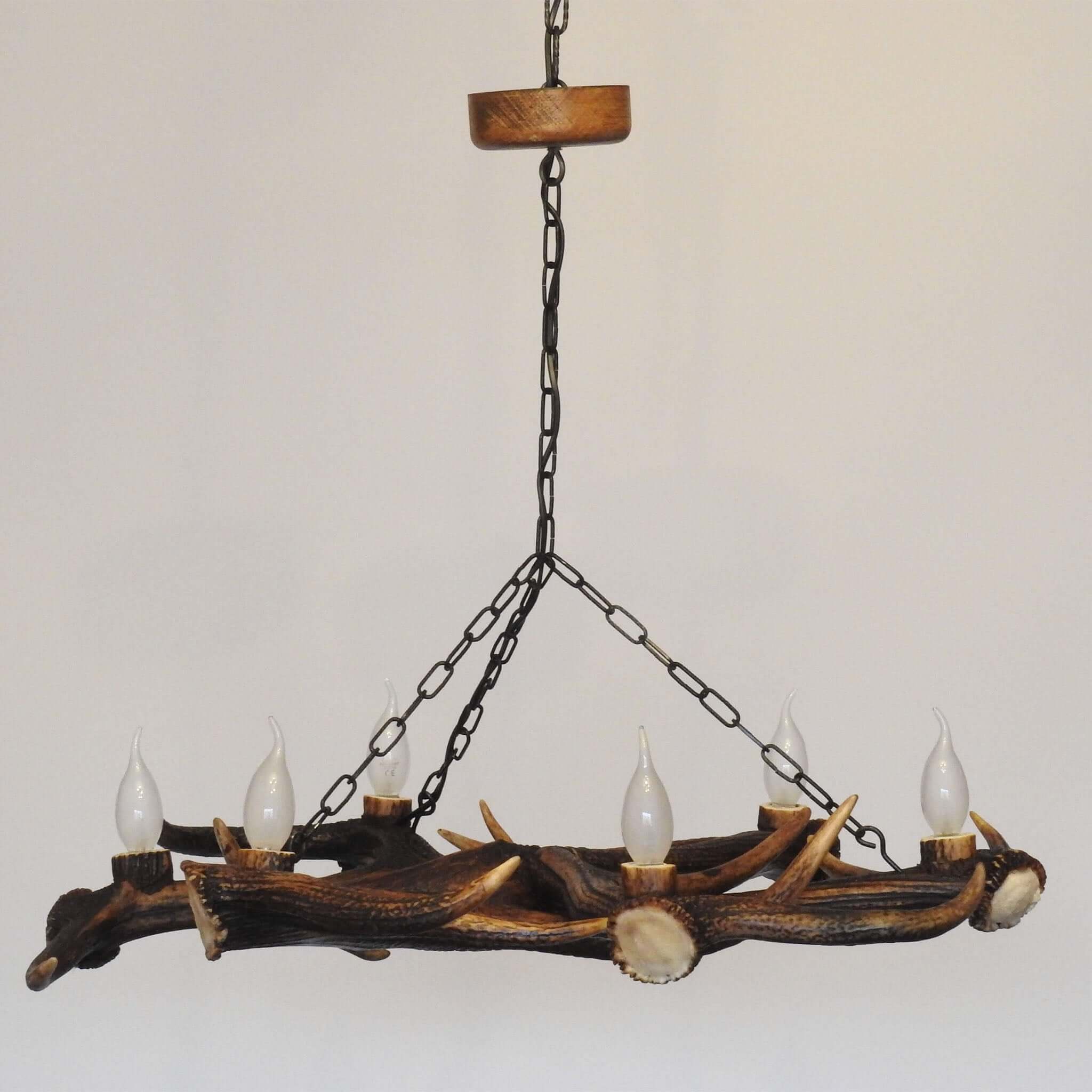 Antler chandelier hanging on chain.