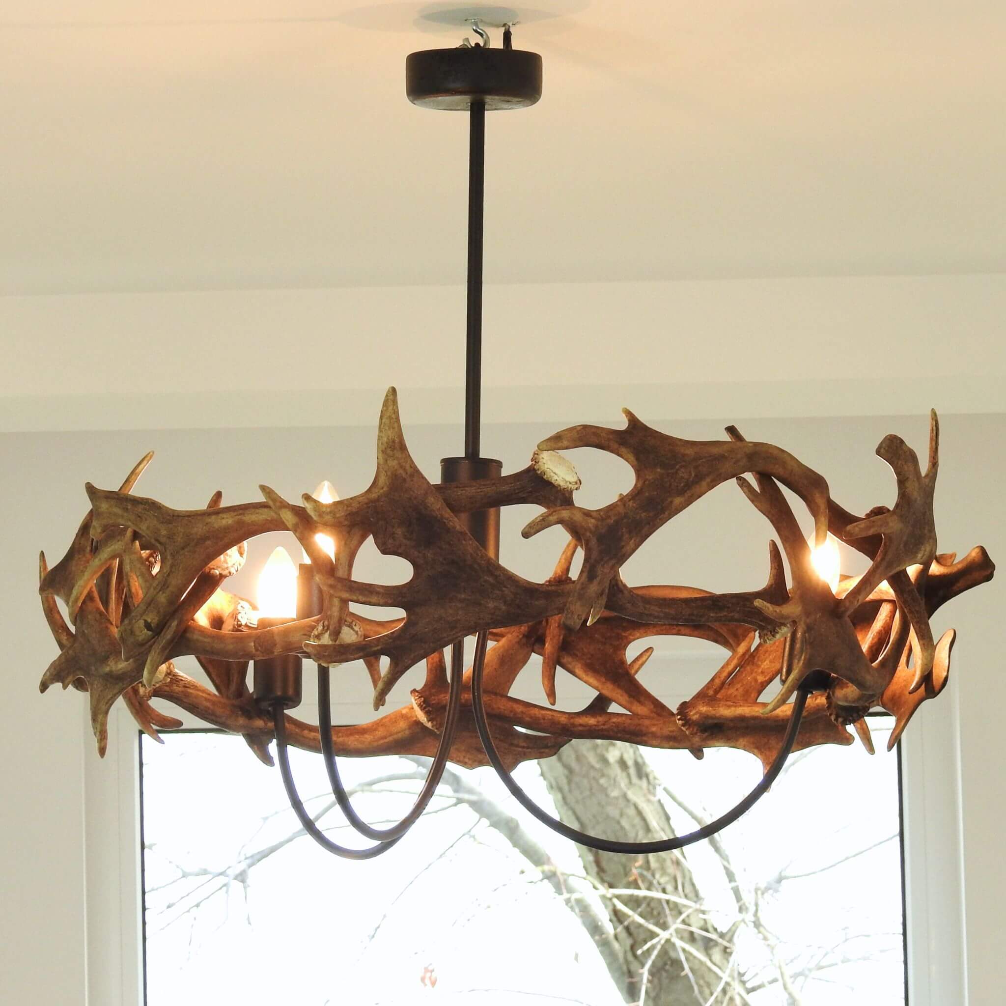 Real antler chandelier in farmhouse.