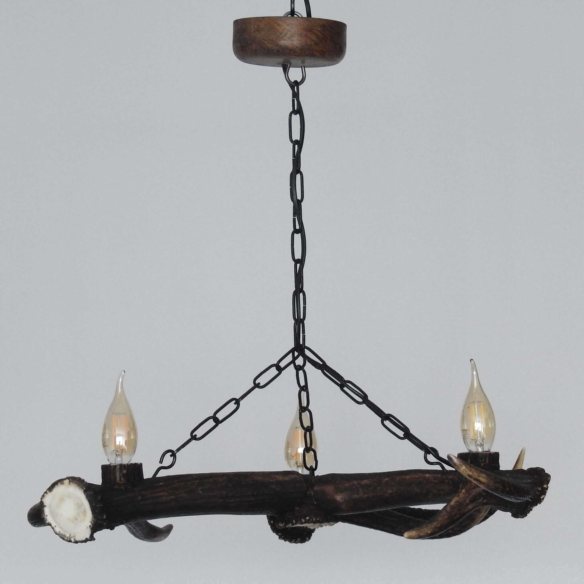 rustic chandelier hanging on chain.